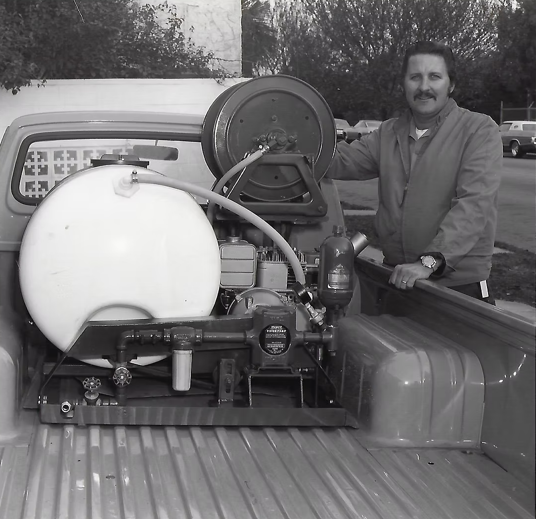 Authentic 1971 black-and-white photograph of founder Jack Sharp Sr. with his route truck rig in Rialto, CA